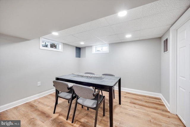 interior space featuring light wood-style flooring, visible vents, and baseboards