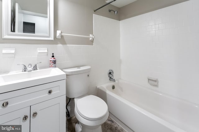 bathroom with toilet, tile walls, bathtub / shower combination, and vanity