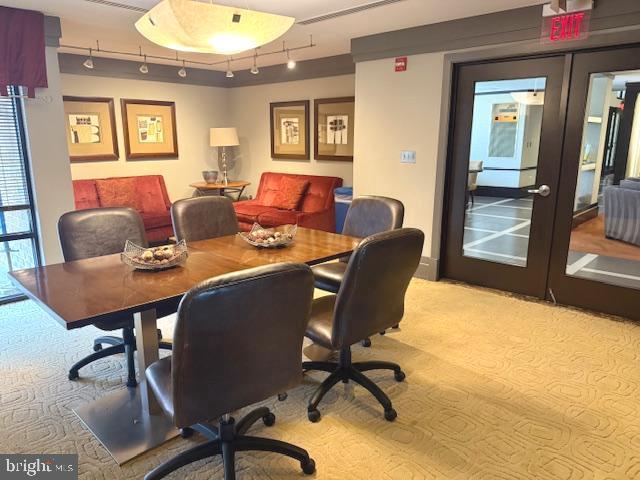 home office with light colored carpet, rail lighting, french doors, and visible vents