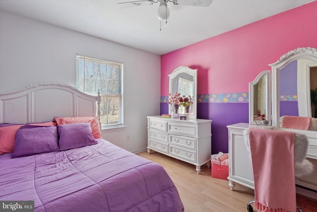 bedroom featuring light wood-type flooring and a ceiling fan