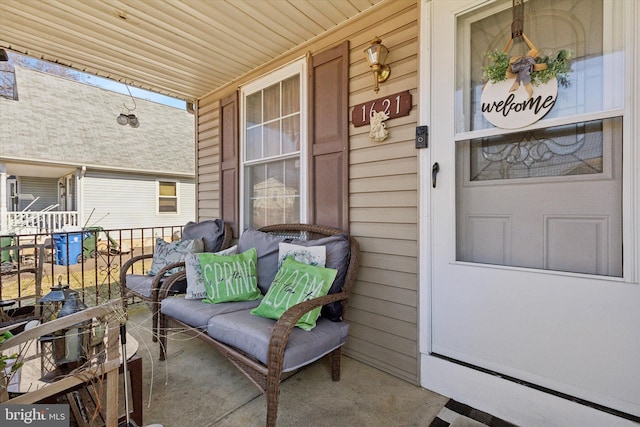 view of exterior entry featuring a porch