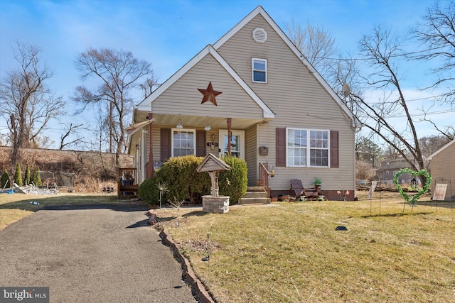 bungalow-style house featuring a front yard