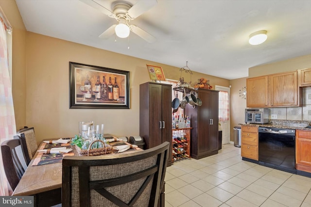 dining room featuring light tile patterned flooring and a ceiling fan