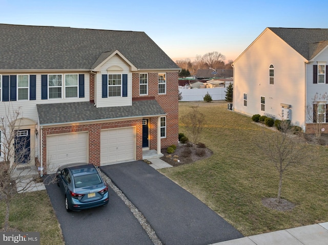 view of property with fence, brick siding, driveway, and a shingled roof