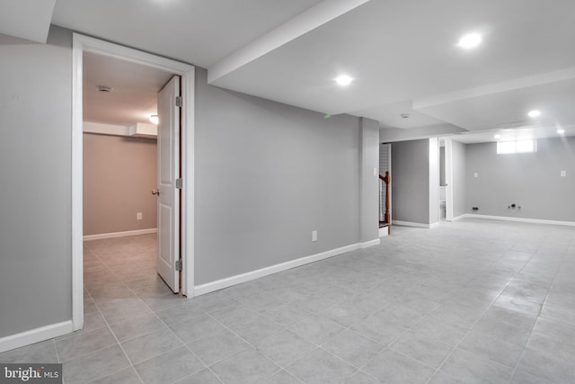 basement with recessed lighting, baseboards, and stairs