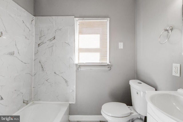 bathroom with toilet, baseboards, and vanity