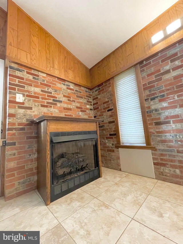 room details featuring wooden walls and a fireplace