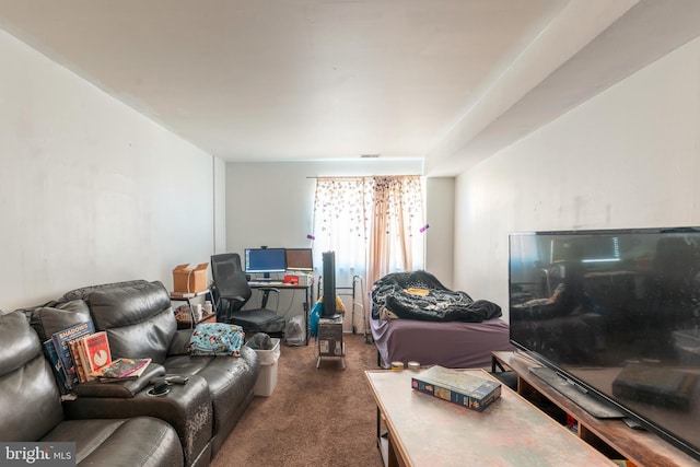 living area with dark carpet