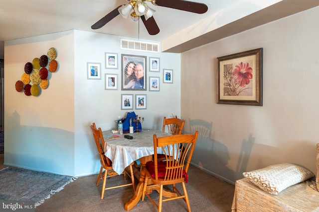 carpeted dining area with a ceiling fan, visible vents, and baseboards