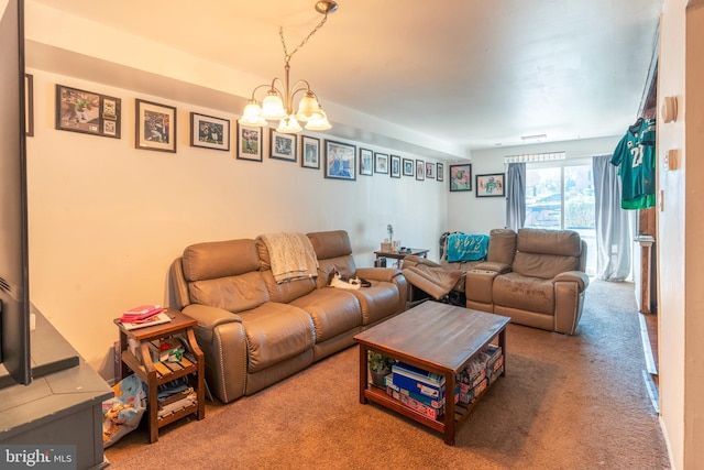 carpeted living area with a chandelier