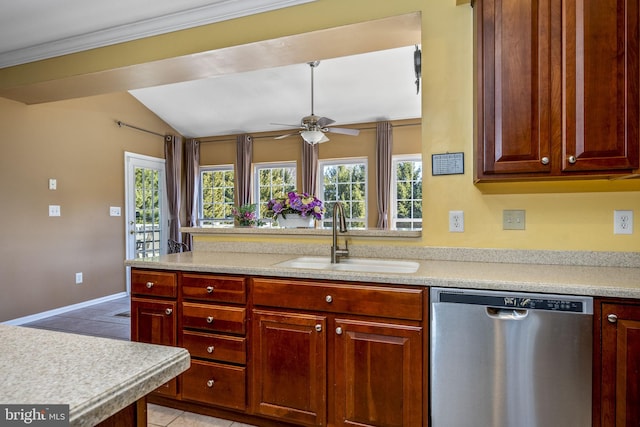 kitchen with a ceiling fan, a sink, stainless steel dishwasher, light countertops, and vaulted ceiling