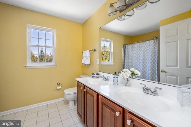 full bathroom with a sink, baseboards, toilet, and tile patterned flooring