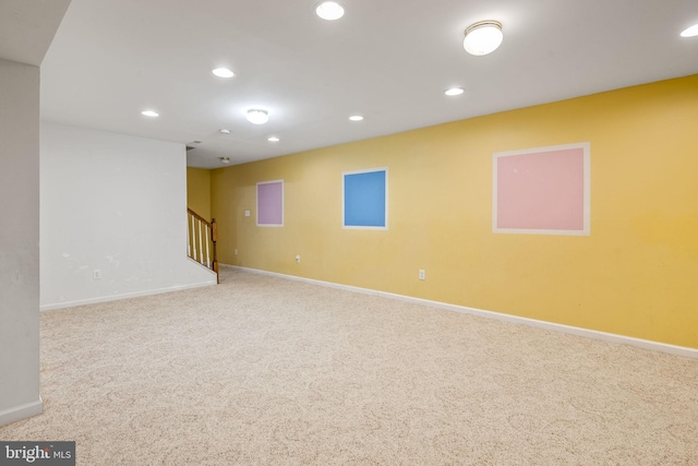 basement featuring stairway, recessed lighting, baseboards, and carpet floors