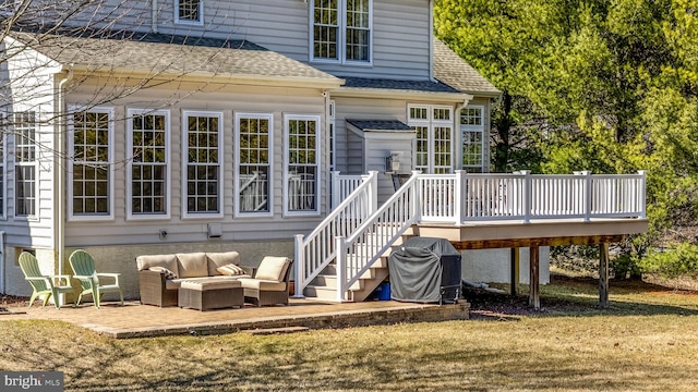 back of property with stairway, a yard, a shingled roof, a deck, and an outdoor hangout area