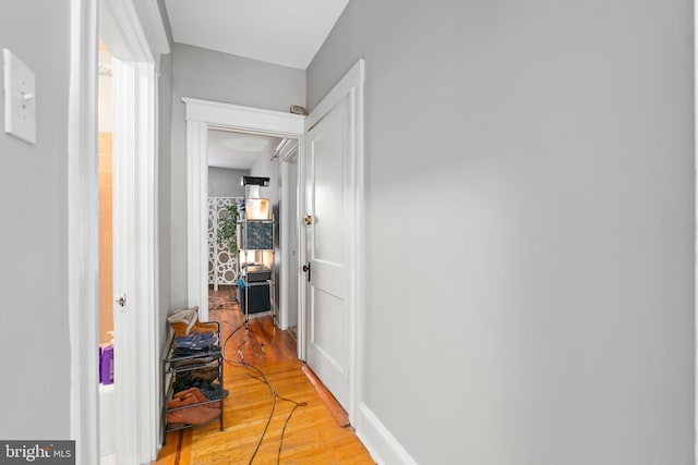 hallway featuring light wood-style flooring