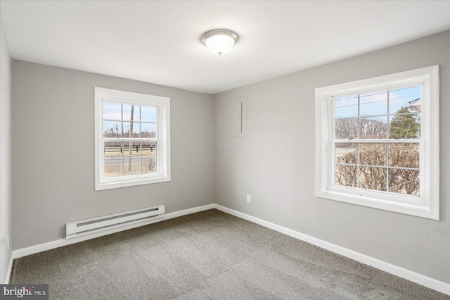 unfurnished room featuring carpet floors, a baseboard radiator, and baseboards