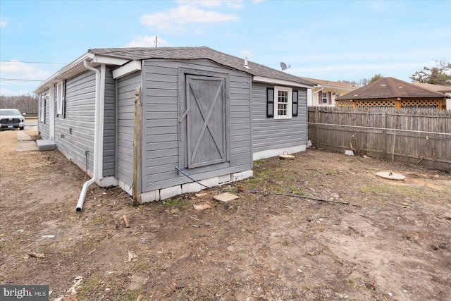 view of outdoor structure featuring an outdoor structure and fence