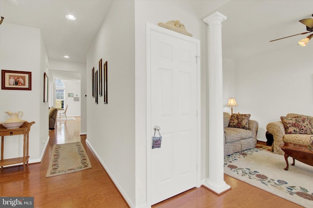 hall with recessed lighting, baseboards, and wood finished floors