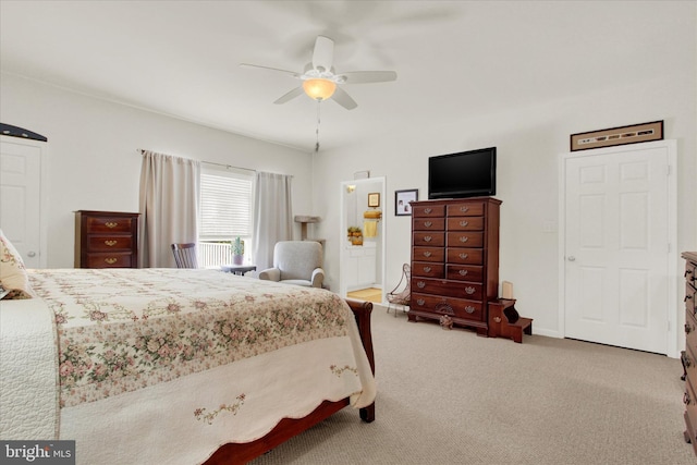 bedroom featuring baseboards, carpet floors, and ceiling fan