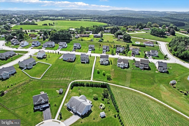 birds eye view of property with a residential view