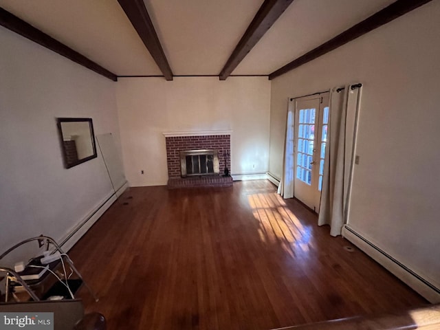 unfurnished living room with beam ceiling, a brick fireplace, wood finished floors, and a baseboard radiator