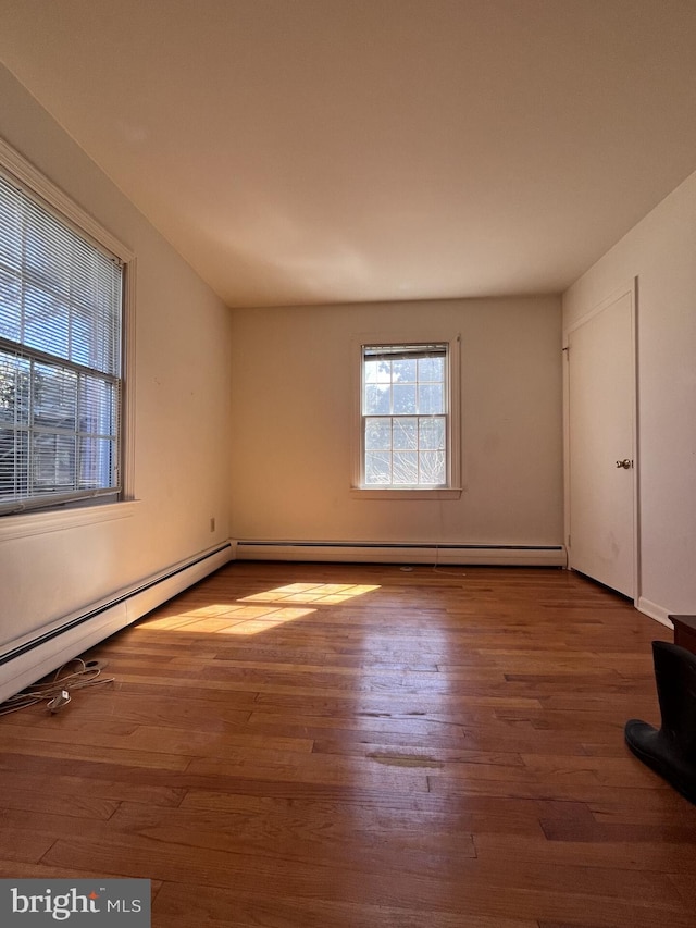 spare room featuring wood finished floors