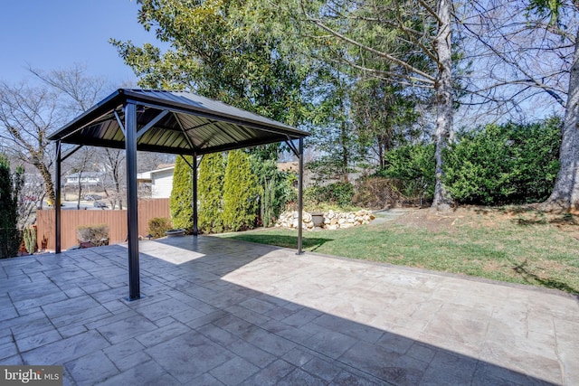 view of patio with a gazebo and fence