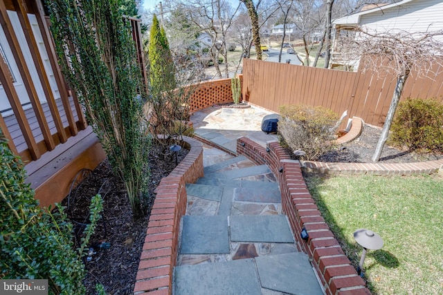 view of yard featuring a patio and fence