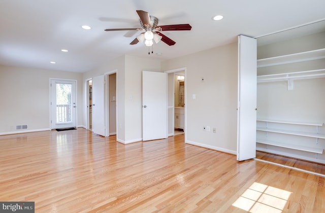 interior space with visible vents, recessed lighting, baseboards, and wood finished floors