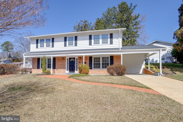 view of front of house featuring a front lawn, driveway, a porch, a carport, and brick siding