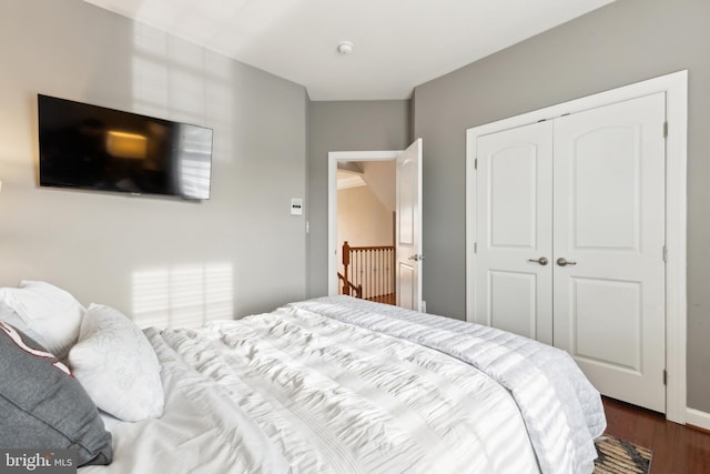 bedroom featuring a closet and wood finished floors