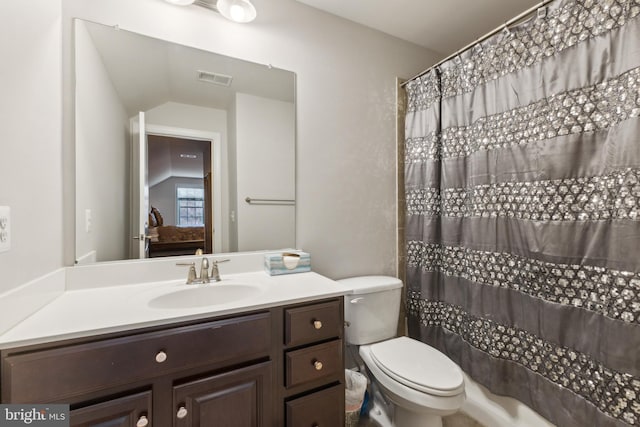 bathroom featuring visible vents, toilet, a shower with shower curtain, lofted ceiling, and vanity