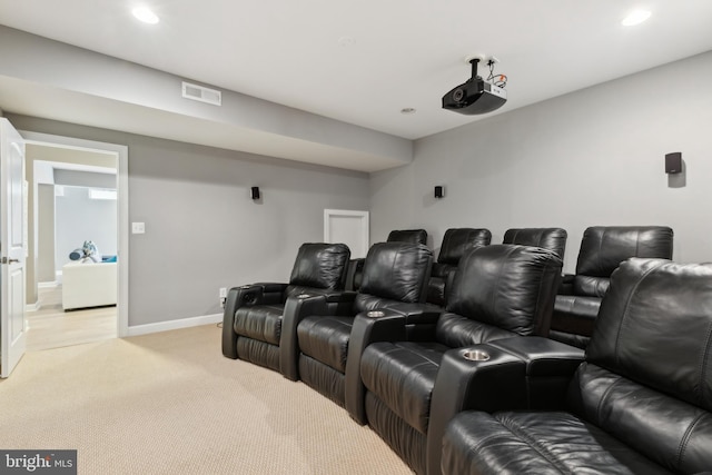 home theater room featuring light carpet, visible vents, recessed lighting, and baseboards