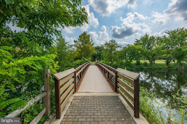 surrounding community featuring a water view