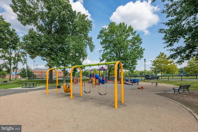 communal playground featuring fence