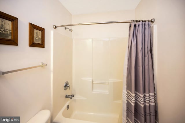 full bathroom with toilet and shower / bath combo