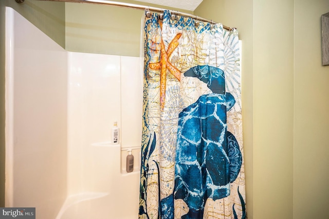 interior space featuring a shower with curtain