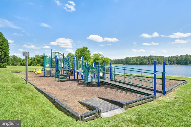 community jungle gym with a lawn and a water view