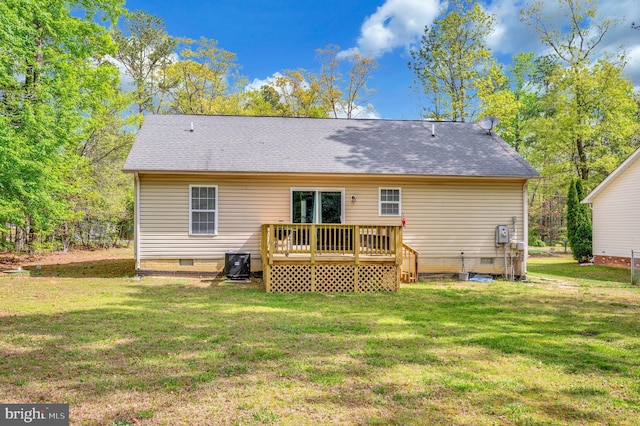 rear view of property with a wooden deck, a yard, crawl space, and a shingled roof