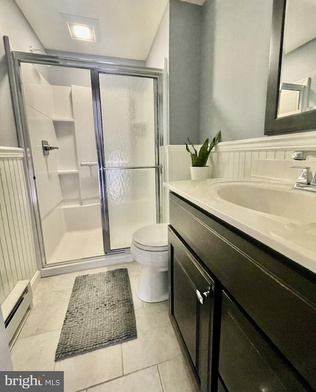 full bath with baseboard heating, a stall shower, vanity, and toilet