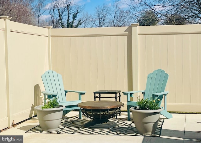 view of patio featuring fence