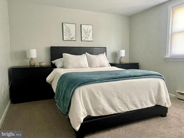 carpeted bedroom featuring baseboards