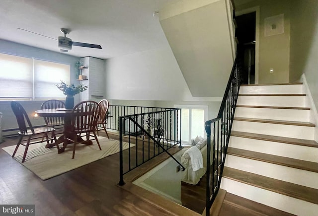 dining room featuring stairway, wood finished floors, and a ceiling fan