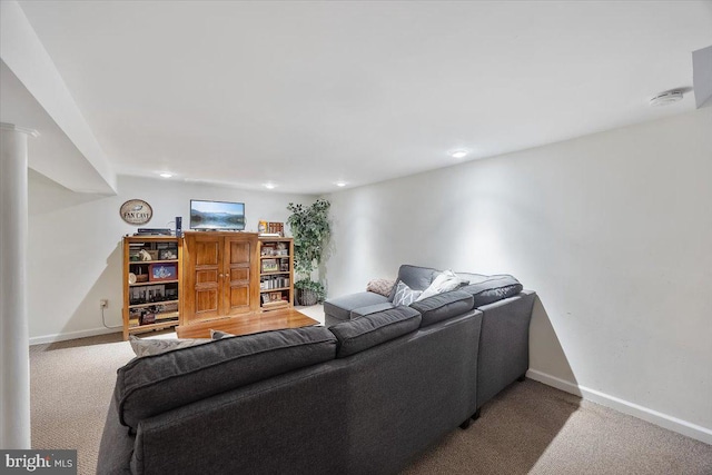 carpeted living room featuring recessed lighting and baseboards