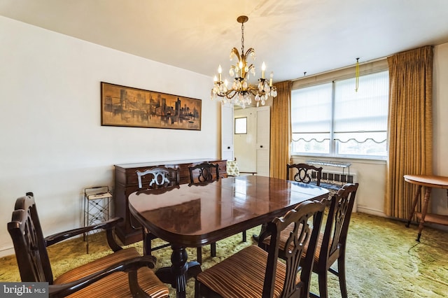 dining area featuring a notable chandelier, baseboards, and carpet