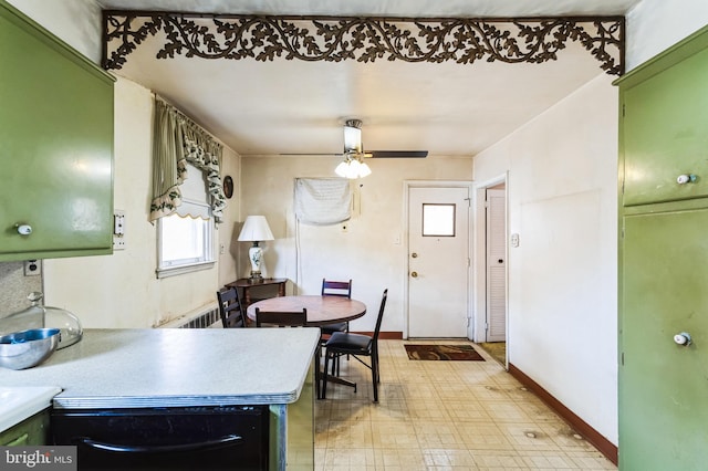 dining room with radiator heating unit, light floors, baseboards, and ceiling fan