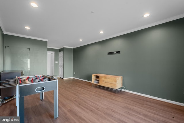 playroom featuring recessed lighting, crown molding, baseboards, and wood finished floors