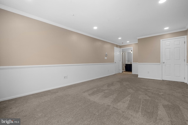 interior space featuring recessed lighting, baseboards, carpet, and crown molding