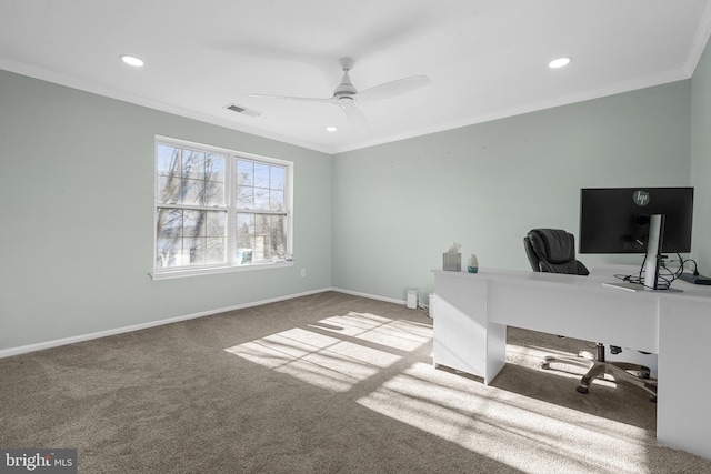 carpeted office space featuring visible vents, baseboards, recessed lighting, ceiling fan, and crown molding