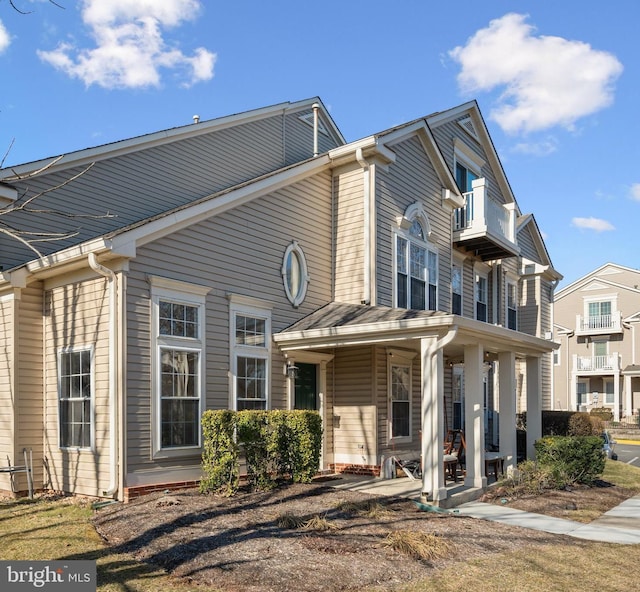 exterior space with a balcony and covered porch